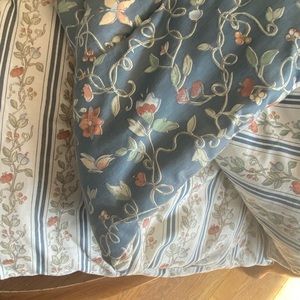 Two matching twin size comforters.